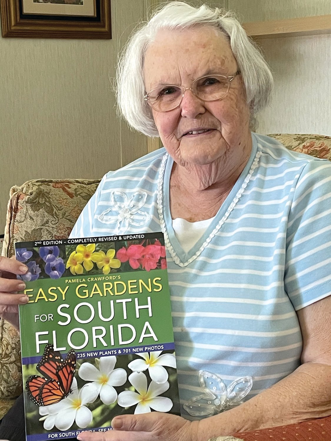 Ann Bowling with the book given as a loving tribute to her, Easy Gardens for South Florida.
